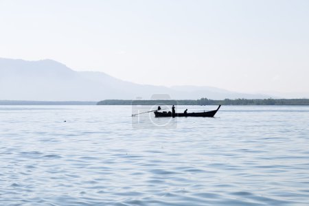 Photo for Silhouettes of fishing boats. Fishing boats sailing in the sea. During the morning, the cold - Royalty Free Image