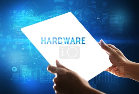 Photo for Hand holdig futuristic tablet with HARDWARE inscription, new technology concept - Royalty Free Image