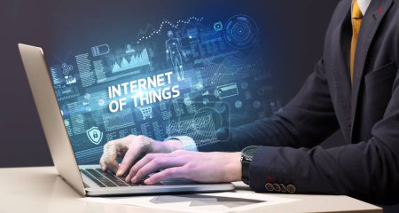 Photo for Businessman working on laptop with INTERNET OF THINGS inscription, cyber technology concept - Royalty Free Image