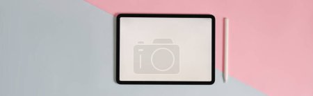 Photo for Two tones color workspace is surrounding by white screen tablet and stylus pen. - Royalty Free Image