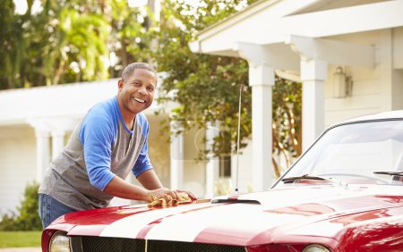 Senior Man Cleaning Car