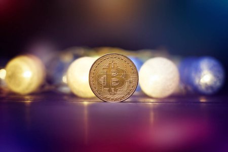 Photo for Bitcoin Stock Growth. Chart shows a strong increase in the price of bitcoin. Bitcoin gold coin and defocused chart background. Virtual cryptocurrency concept. - Royalty Free Image