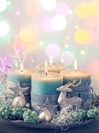 Photo for Four green christmas candle and decoration - Royalty Free Image