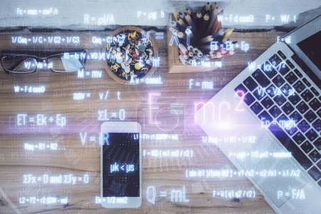 Photo for Double exposure of formula drawing over table with phone. Top view. Education concept. - Royalty Free Image