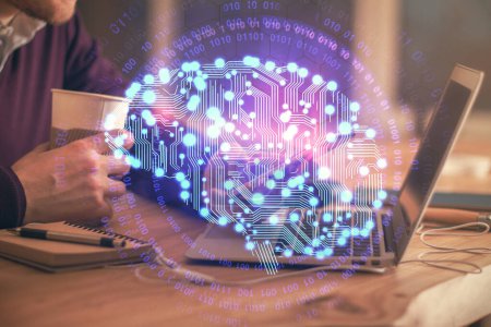 Photo for Double exposure of man's hand holding and using a digital device and brain hologram drawing. Data concept. - Royalty Free Image