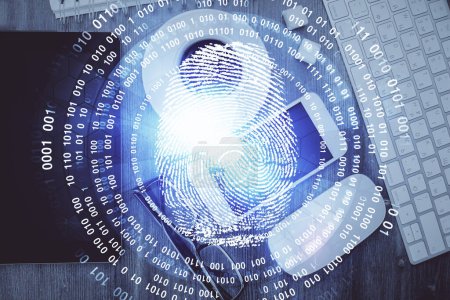 Photo for Double exposure of finger print over table with phone. Top view. Concept of mobile security. - Royalty Free Image