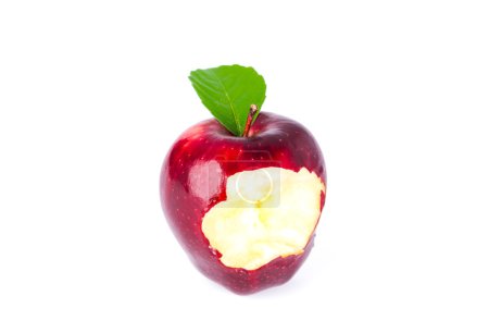 Red apple with green leaf and missing a bite .