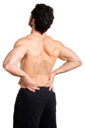 Photo for Male athlete with pain in his lower back, isolated in white - Royalty Free Image