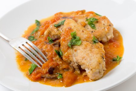 Harina de pechuga de pollo provenzal con tenedor

