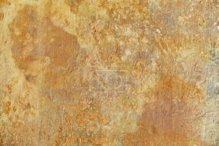 Old plastered surface of yellow color