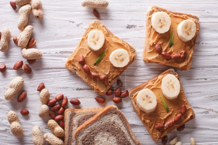 Funny sandwiches with peanut butter. horizontal top view