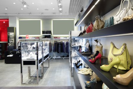 Photo for Bright and fashionable interior of shoe store in modern mall - Royalty Free Image