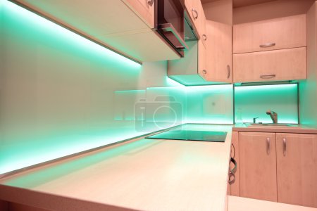 Modern luxury kitchen with green LED lighting