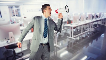 Composite image of businessman with megaphone