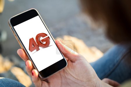 Photo for Close-up view of young woman checking her 4g mobile phone - Royalty Free Image