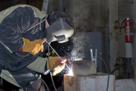 Photo for Welder working on welding of shells heat exchanger - Royalty Free Image