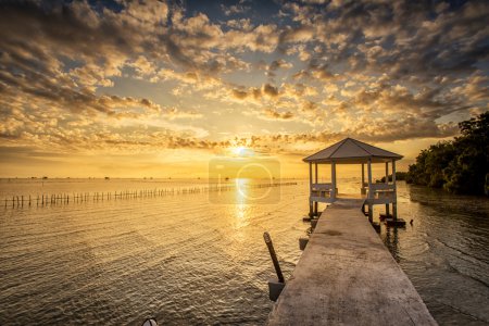 Sunrise time Thai fisherman village in Bangtaboon Petchaburi, Th