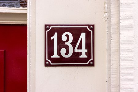 Photo for Enameled house number one hundred and thirty four - Royalty Free Image