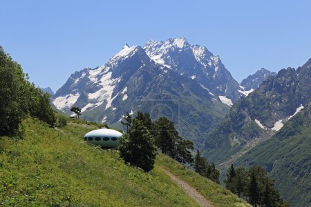 Photo for The hotel is in the form of a flying saucer on the mountain Mussa-Achitara, Dombai, Caucasus, Russia - Royalty Free Image