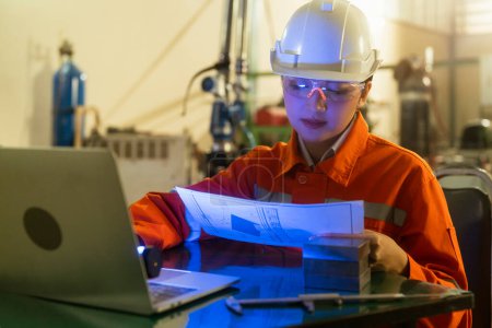 Photo for Asian female engineer specialist with Measuring machine with a manipulator arm.Three-dimensional coordinate measurement. Check sizes. 3D check of the sizes of parts. CMM after machining process - Royalty Free Image