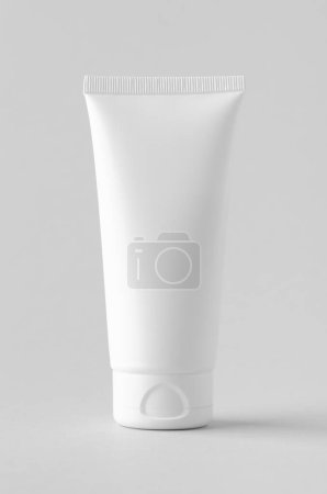 Photo for White plastic cream tube mockup on a grey background. - Royalty Free Image