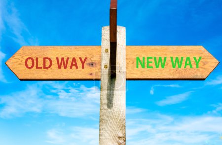 Photo for Wooden signpost with two opposite arrows over clear blue sky, Old Way and New Way signs, Life change conceptual image - Royalty Free Image