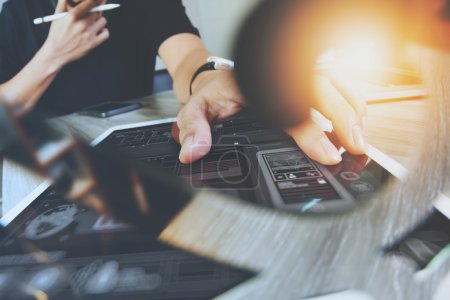 Photo for Website designer working digital tablet and computer laptop with smart phone and digital design diagram on wooden desk as concept - Royalty Free Image