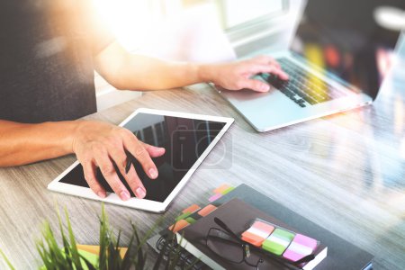 Photo for Website designer working blank screen digital tablet and computer laptop with smart phone on wooden desk as concep - Royalty Free Image