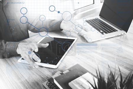 Photo for Website designer working blank screen digital tablet and computer laptop with smart phone on wooden desk as concept. virtual screen , black whit - Royalty Free Image
