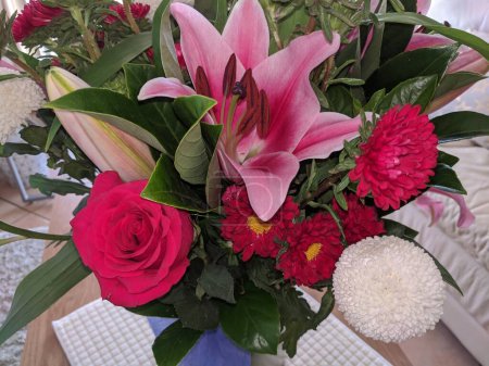 Photo for Floral display including Flashpoint pink and white Oriental Trumpet Lily closeup.Beauty in nature image. - Royalty Free Image