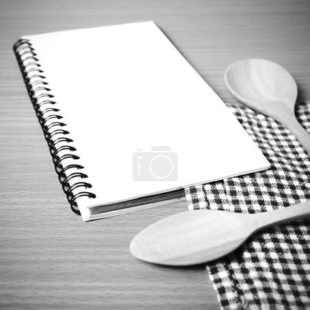 Photo for Notebook and kitchen tools on table black and white color tone style - Royalty Free Image