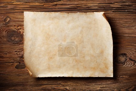 Photo for Old blank parchment on aged wood background,horizontal - Royalty Free Image