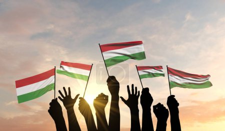 Silhouette of arms raised waving a Hungary flag with pride. 3D Rendering