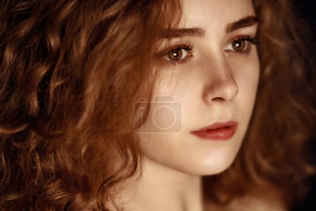 Photo for Portrait of a beautiful girl, redhead curly hair, close-up - Royalty Free Image