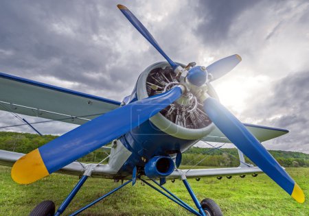 Photo for Technical service of the old retro plane before the flight. - Royalty Free Image