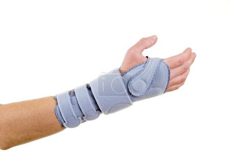 Man Wearing Supportive Wrist Brace in Studio