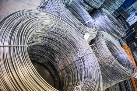 Photo for Rolls of aluminum metal fittings (steel armature). Heavy industry production - Royalty Free Image