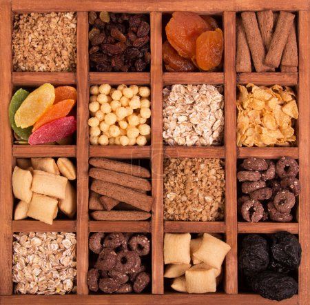 Photo for Arrangement of Dried Fruits and Nuts in Wooden Box closeup top view - Royalty Free Image