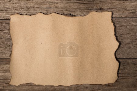 old paper on brown aged wood