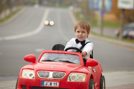 little boy driving car