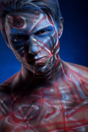 Photo for Creepy portrait of a halloween man with bloody body art and face art - Royalty Free Image