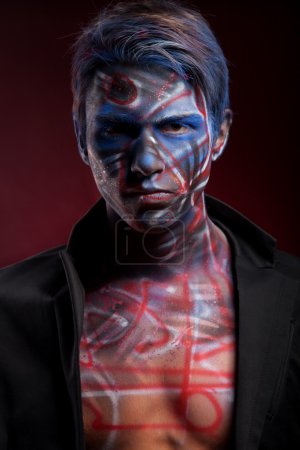 Photo for Creepy portrait of a halloween man with bloody body art and face art - Royalty Free Image