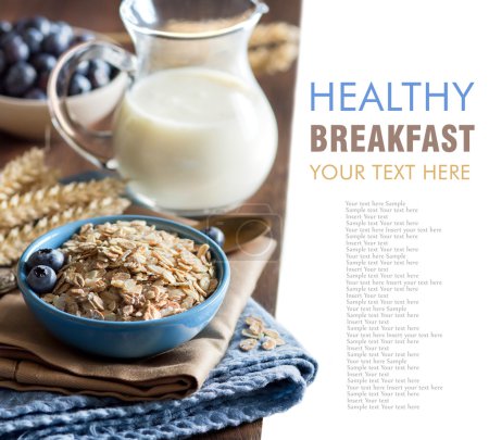 Rolled oats in a bowl with berries and milk