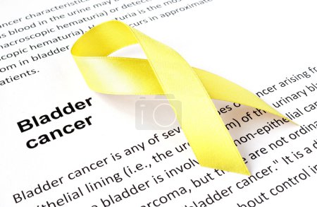 Photo for Paper with bladder cancer and yellow ribbon - Royalty Free Image