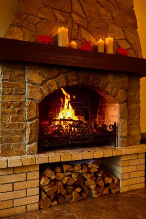 Photo for Burning fireplace. Fireplace as a piece of furniture. - Royalty Free Image