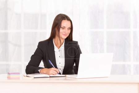 Photo for Female student. Modern business woman working in bright office. Manager, secretary. Woman in the office of the company. The fitness in the workplace. Office fitness. Raise their hands to the top. - Royalty Free Image