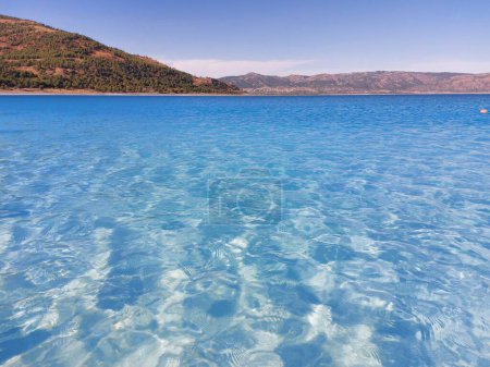 Photo for The blue clear water of Lake Salda in Turkey with a mountain in the background. High quality photo - Royalty Free Image