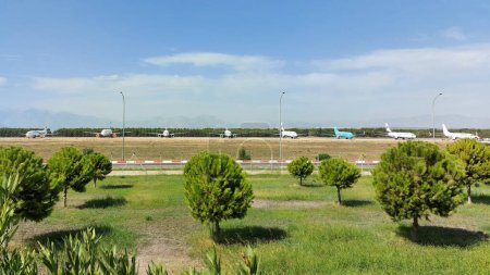 Photo for Turkey, Antalya, September 2020, planes of different airlines stand in a row in the distance on the runway at the international airport - Royalty Free Image