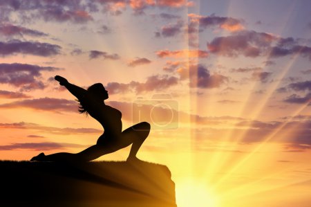 Photo for Concept of meditation and relaxation. Silhouette of a girl practicing yoga exercise on the sunset background - Royalty Free Image