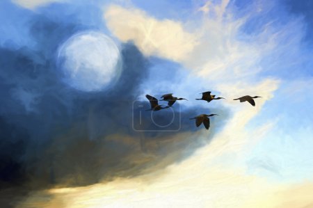 Photo for Birds moon is a flock of birds flying at twilight against a colorful full moon cloudscape. - Royalty Free Image